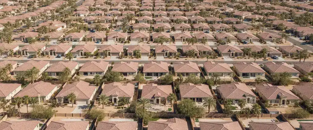Well-maintained residential rooftops in Henderson, Clark County, Nevada, with arid mountains in the distance