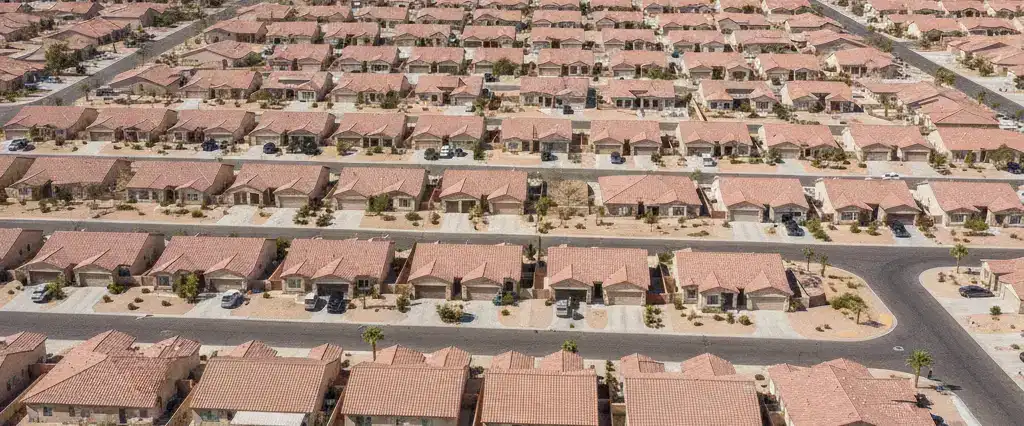 Well-maintained residential rooftops in North Las Vegas, Clark County, Nevada, with arid mountains in the distance