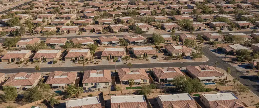 Well-maintained residential rooftops in Mesa, Maricopa County, Arizona, with arid desert mountains in the distance