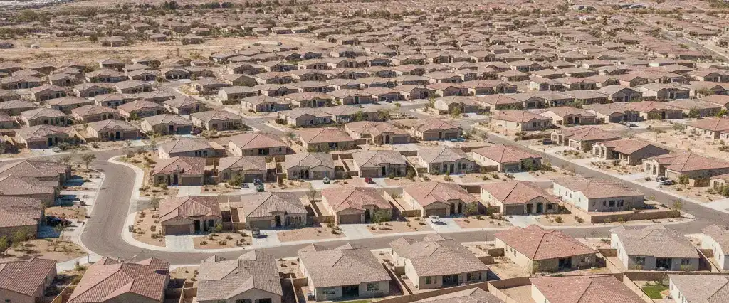 Well-maintained residential rooftops in Queen Creek, Maricopa County, Arizona, with arid desert mountains in the distance