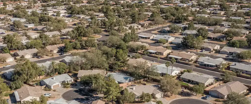 Well-maintained residential rooftops in Tempe, Maricopa County, Arizona, with arid desert mountains in the distance