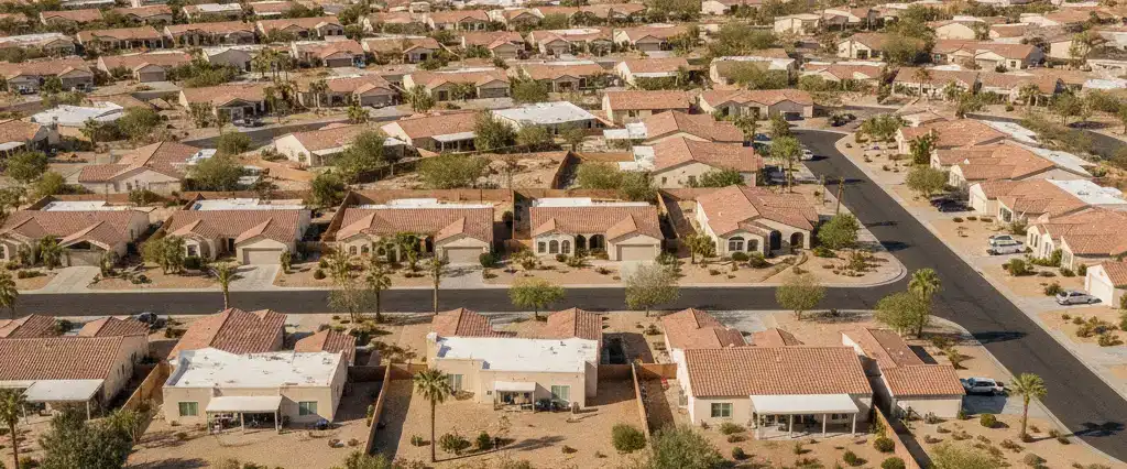 Well-maintained residential rooftops across Clark County, Nevada, with arid mountains in the distance