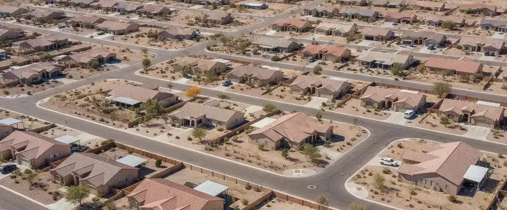 Well-maintained residential rooftops across Mohave County, Arizona, with arid desert mountains near the Colorado River